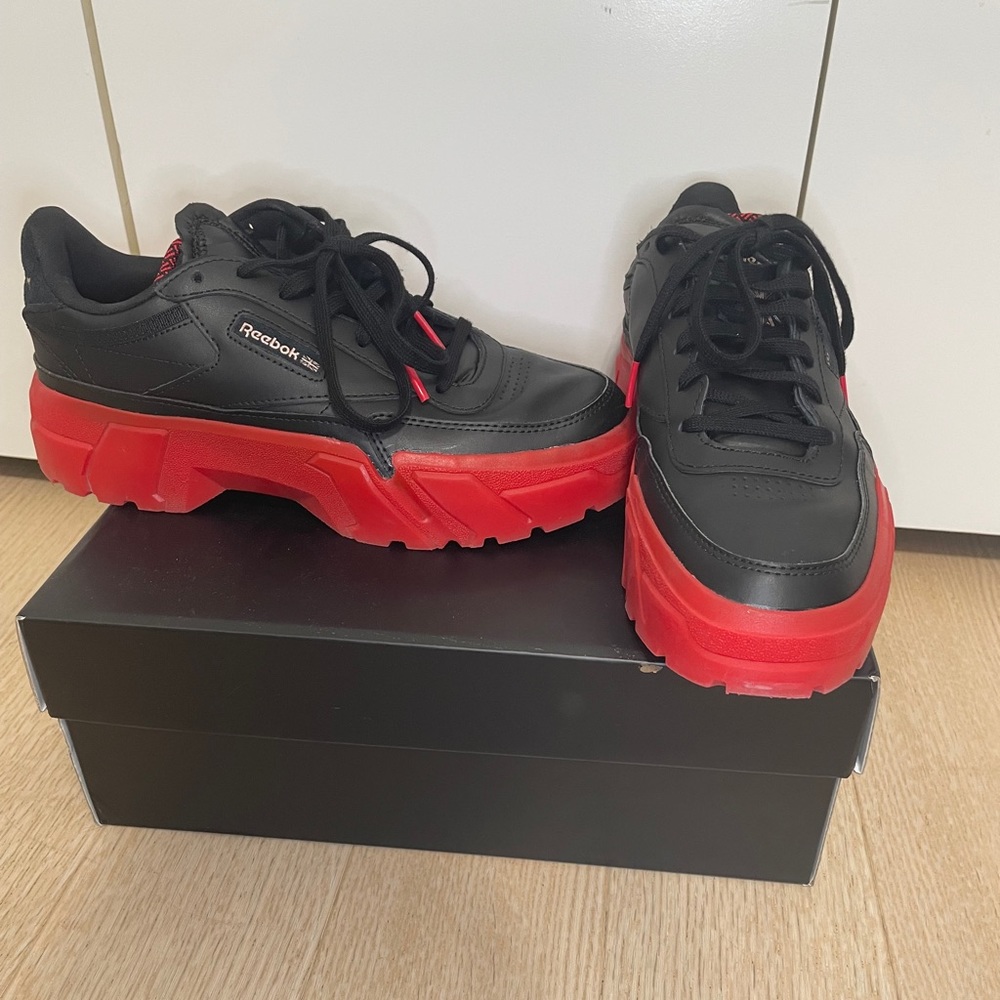 Cardi B/Club C Reebok collab in black and red